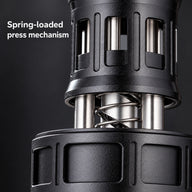 Close-up of the espresso distributor's spring-loaded press mechanism and metal guide posts.