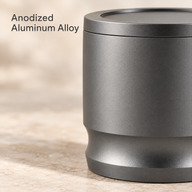 Close-up of the anodized aluminum alloy finish and curved dosing cup base