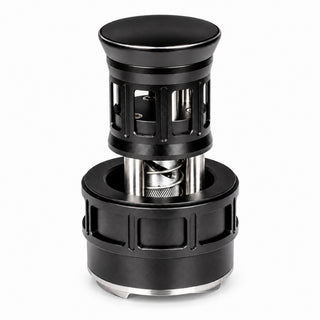 Black 58mm press-style rotating espresso distributor with adjustable depth and a stainless steel base.