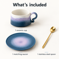 One ceramic coffee cup, one matching saucer and one gold-colored stainless steel spoon displayed separately