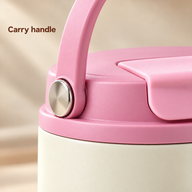 Close-up of the pink cup lid, matching carry handle and silver side pivot.