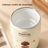 Tasse ouverte avec intérieur blanc revêtu de céramique, fin bord argenté et inscription marron