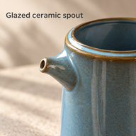 Close-up of the blue serving jug short glazed ceramic spout and open rim