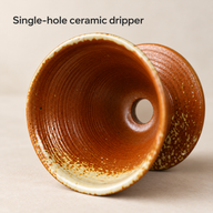 Interior of the amber ceramic cone dripper showing concentric rings and a single outlet