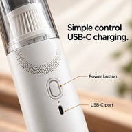 White coffee vacuum detail showing oval power button and USB-C charging port