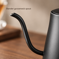 Close-up of the curved black gooseneck spout and angled metal opening