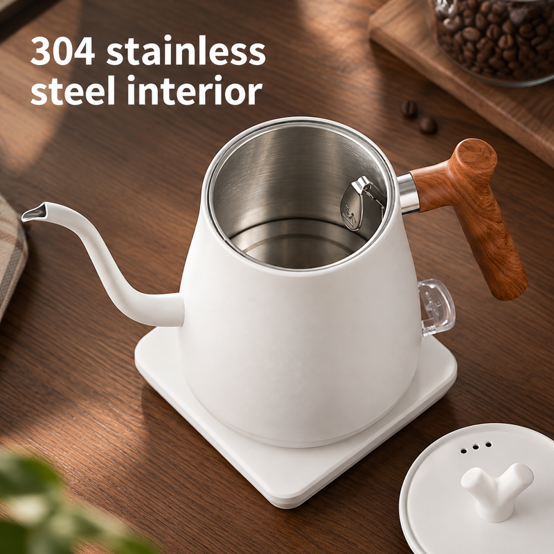 Open white electric kettle showing the 304 stainless steel interior with its lid alongside