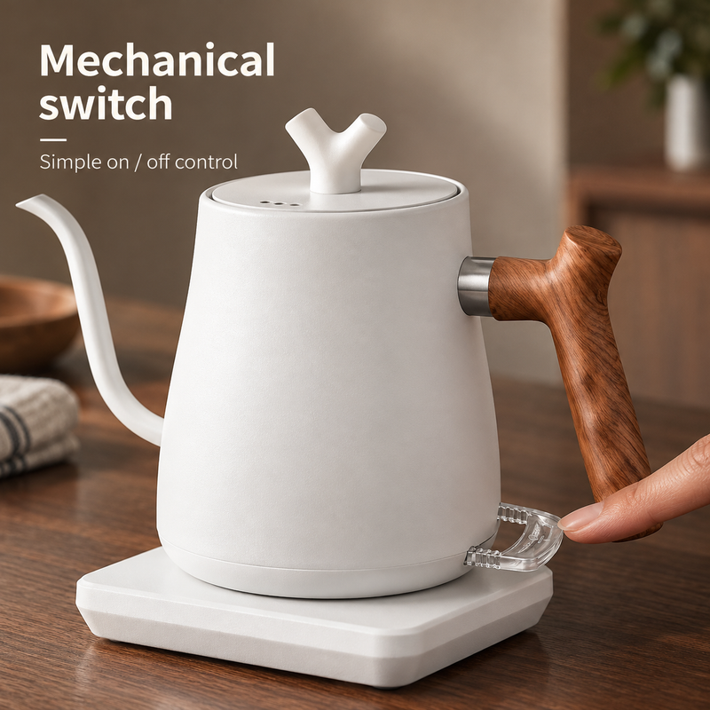 Finger pressing the clear mechanical on-off switch beneath the wooden handle of the white kettle