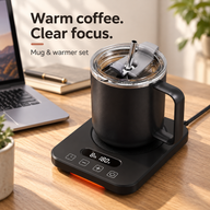 Black mug and electric warmer set on a home office desk beside a laptop