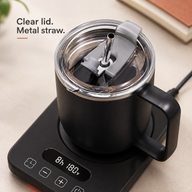 Close-up of the black mug clear lid, gray closure, metal rim and metal straw