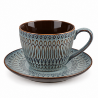 Blue-gray embossed ceramic coffee cup with dark brown interior and matching saucer on white