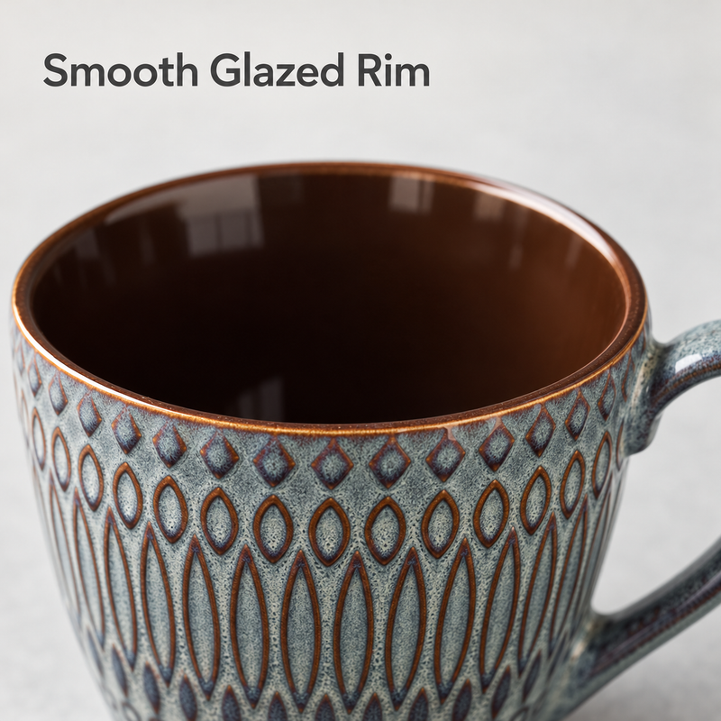 Close-up of the coffee cup's smooth brown glazed rim and dark brown interior