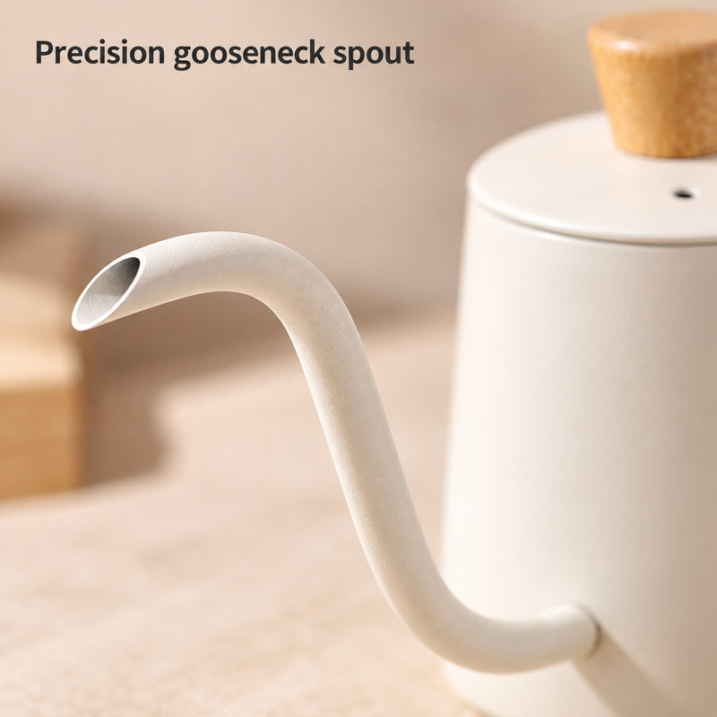 Close-up of the ivory kettle's curved gooseneck spout and angled oval opening.