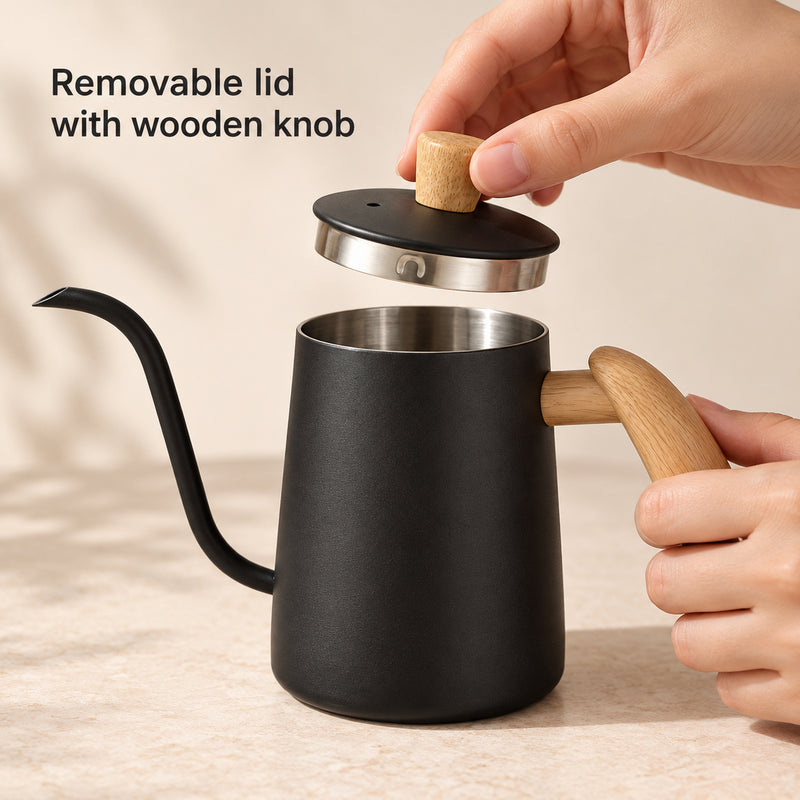 Hand lifting the matte black kettle's wooden-knob lid to reveal the stainless steel rim and retaining detail.