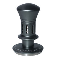 Gunmetal spring-loaded espresso tamper with rounded handle and stainless steel base