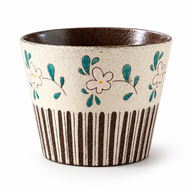 Floral Stripe handleless ceramic cup with cream flowers, teal leaves and brown vertical stripes on white.