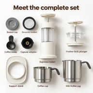 White espresso maker kit with coffee cup, milk frother, support stand, grounds basket, scoop and capsule adapter