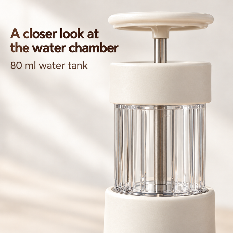 Close-up of the manual espresso maker's transparent ribbed 80 ml water tank and press plunger