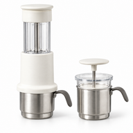White manual espresso maker with stainless steel coffee cup and matching manual milk frother