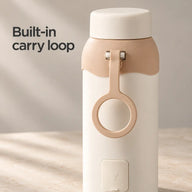 Rear view of the portable kettle's apricot carry loop and covered power inlet