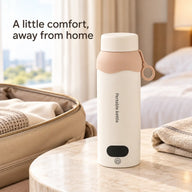 Ivory portable travel kettle beside a travel bag in a hotel room