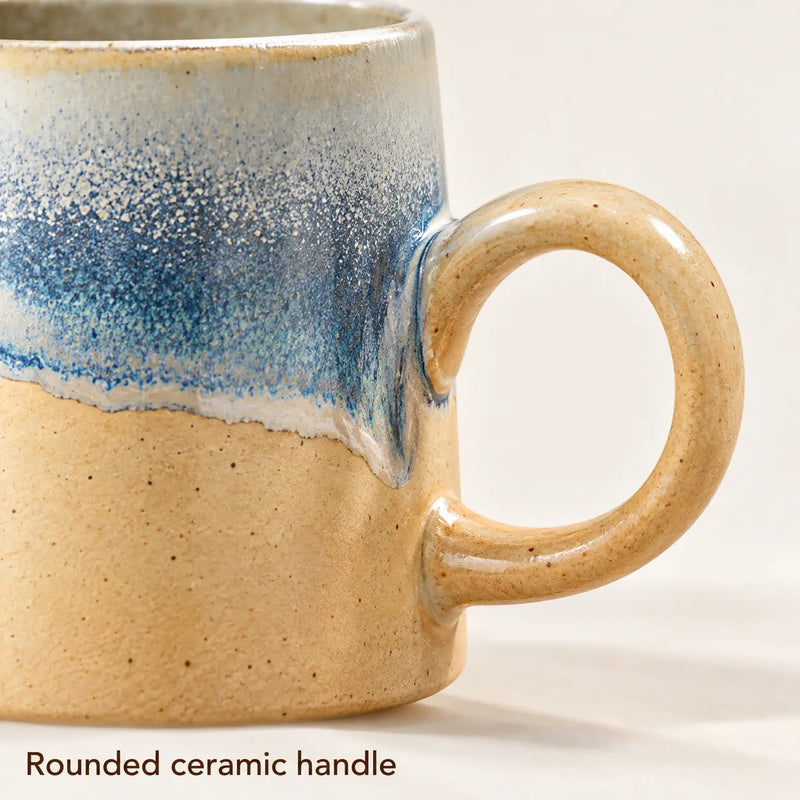 Close-up of the round beige ceramic handle and its attachment points