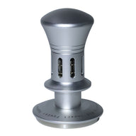 Silver spring-loaded espresso tamper with rounded handle and stainless steel base