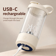 USB-C cable connected to the charging port underneath the cream stirring cup base