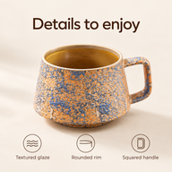 Ceramic mug with labels identifying the textured glaze, rounded rim and squared handle