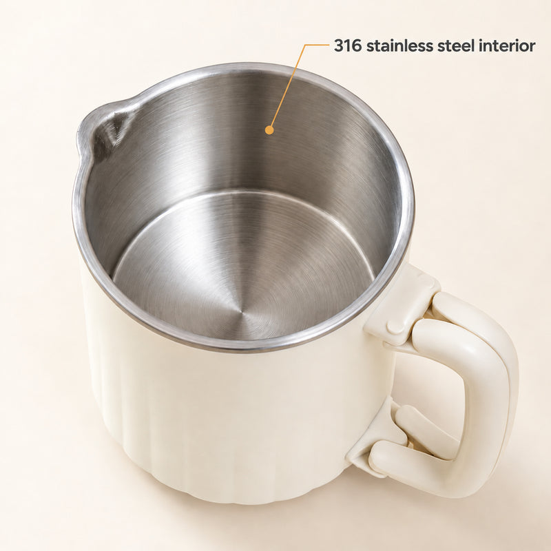 Close-up of the brushed 316 stainless steel interior, rim and pouring lip of the cream kettle.