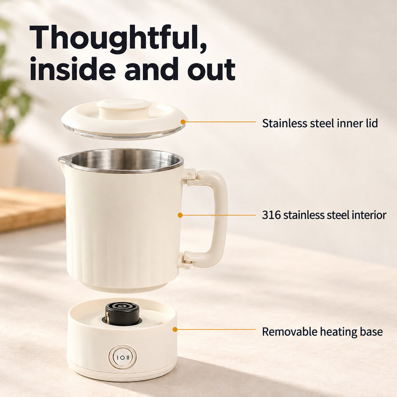 Separated lid, cream kettle body with stainless steel interior and removable heating base.