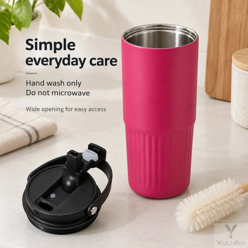 Open rose pink tumbler with a wide stainless steel opening and hand-wash care instructions