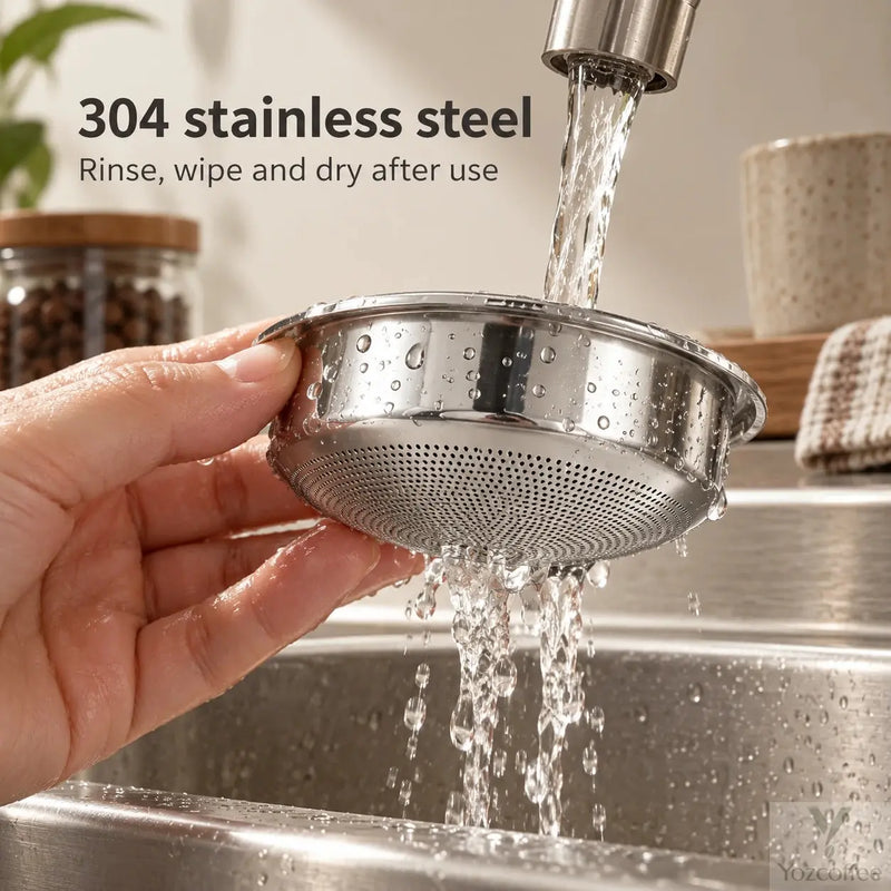 Hand rinsing the rounded 304 stainless steel espresso filter basket under running water