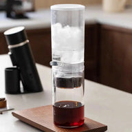 Cold drip iced coffee maker with glass carafe and filter