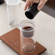 Slow-drip iced coffee maker with adjustable flow valve