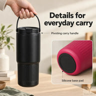 Black tumbler lifted by its pivoting carry handle with an inset view of the silicone base pad