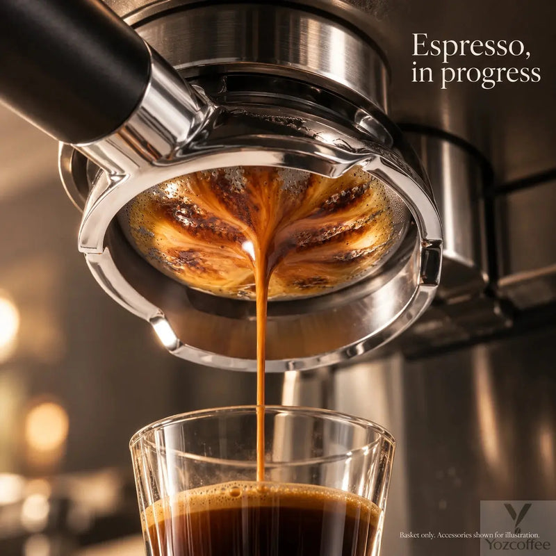Espresso flowing through the Yozcoffee 58mm rounded filter basket in a bottomless portafilter into a glass