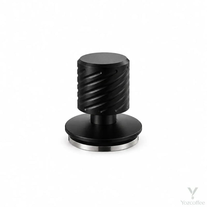 Yozcoffee matte black spring-loaded espresso tamper on white with grooved handle and silver stainless steel base