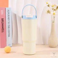 White Yozcoffee 750ml tumbler with folding carry handle and closed dual-drink lid