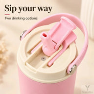 Close-up of the pink tumbler lid with flip-up straw spout and direct-sip opening