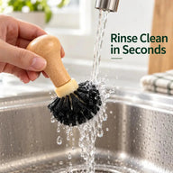 Portafilter cleaning brush in use while rinsing