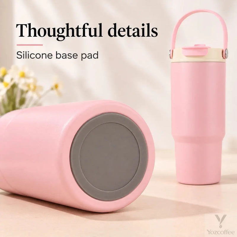 Close-up of the gray silicone base pad on the pink stainless steel tumbler
