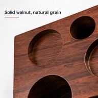 Close-up of natural walnut grain and routed circular tool recesses