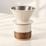 AI-generated close-up photo of cream reusable dripper on matching wood-band cup