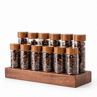 Yozcoffee coffee bean storage set with 12 clear glass tubes and a walnut base on a white background