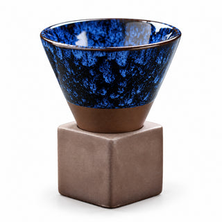Deep Blue 200ml kiln-glazed ceramic coffee cup seated in its brown square base