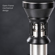 Close-up of the open-frame mechanical impact tamper mechanism