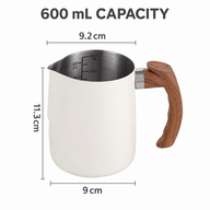 Cream-white 600 ml milk pitcher size guide showing 11.3 cm height, 9 cm base and 9.2 cm opening across spout