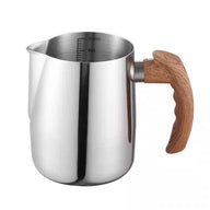 Silver 600 ml stainless steel milk frothing pitcher with pointed spout and faux wood-grain handle
