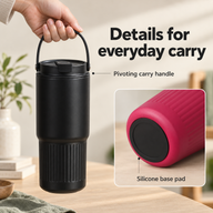 Black tumbler lifted by its pivoting carry handle with an inset view of the silicone base pad